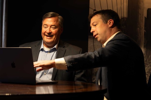 Person showing Maestro Systems Survey on a computer